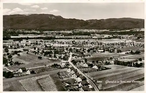 AK / Ansichtskarte Gland__VD Fliegeraufnahme GEsamtansicht m. Jura 