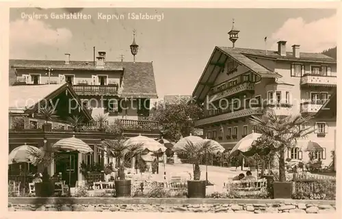 AK / Ansichtskarte Kaprun Orglers Gaststaetten Aussenansicht m. Cafe Terrasse Kaprun