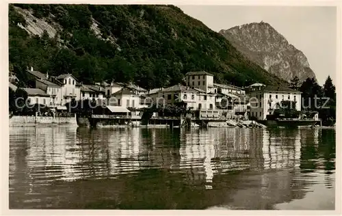 AK / Ansichtskarte Melide_Lago_di_Lugano Teilansicht v. Wasser aus ges. Melide_Lago_di_Lugano