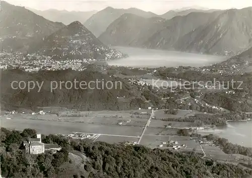 AK / Ansichtskarte Agno_Lago_di_Lugano_TI Fliegeraufnahme Blick v. Santa Maria auf Agno   Panorama m. See 