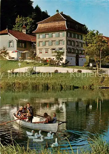 AK / Ansichtskarte Magdenau_Botsberg_Flawil_SG Landgasthof Roessli Uferpartie am Teich Enten Ruderboot 