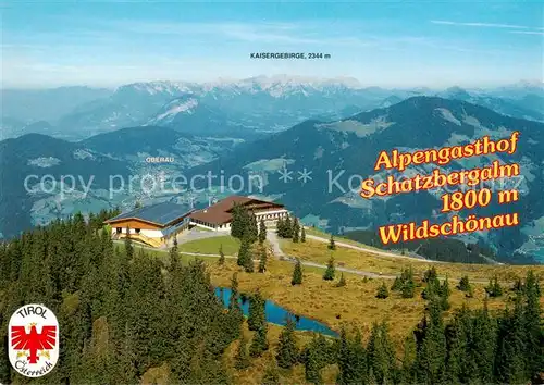 AK / Ansichtskarte 73802841 Thierbach_Wildschoenau Alpengasthof Schatzbergalm mit Kaisergebirge Fliegeraufnahme Thierbach Wildschoenau