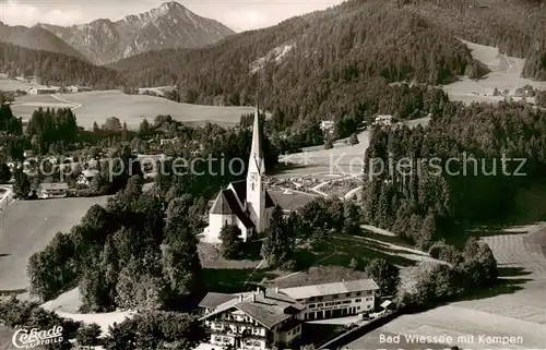 AK / Ansichtskarte 73810985 Bad_Wiessee Ortsansicht mit Kirche Blick zum Kampen Tegernseer Berge Bad_Wiessee