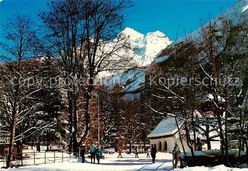AK / Ansichtskarte Kandersteg_BE Winterpanorama mit Dohlen Bluemlisalp und Dorfkirche Kandersteg_BE
