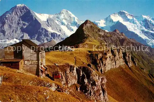 AK / Ansichtskarte Maennlichen Luftseilbahn mit Bergstation und Hotel Eiger Moench Jungfrau Tschuggen Maennlichen