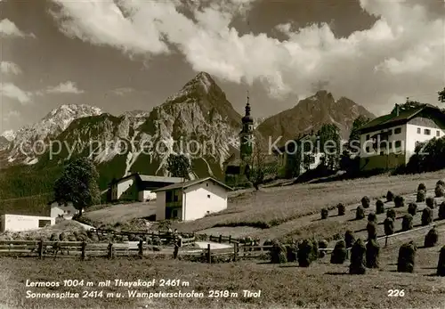 AK / Ansichtskarte  Lermoos_Tirol_AT Ortsansicht mit Kirche Blick gegen Thayakopf Sonnenspitze Wamperter Schrofen 