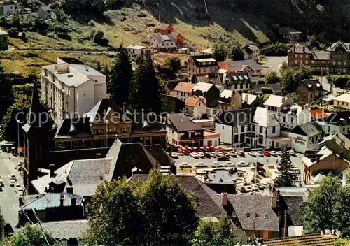 AK / Ansichtskarte  Le_Mont-Dore_63 Station thermale et touristique Vue sur leglise et la place des Moulins 