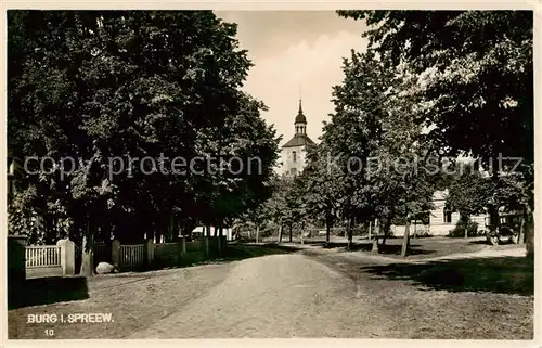 AK / Ansichtskarte 73819296 Burg_Spreewald Baumallee Kirche Burg Spreewald