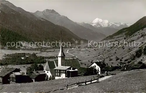 AK / Ansichtskarte Muenster_Goms_VS mit Kirche und Weisshorn 