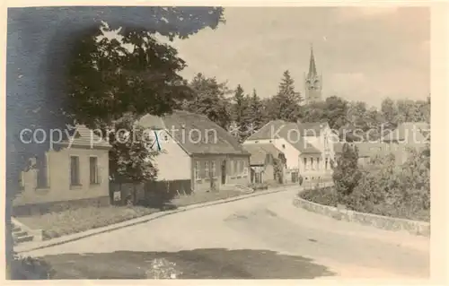 AK / Ansichtskarte  Feldberg_Mecklenburg_Bad Dorfstrasse mit Kirche Feldberg_Mecklenburg_Bad