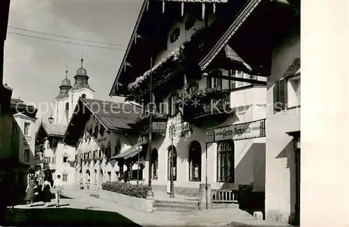 AK / Ansichtskarte  St_Johann_Tirol Dorfmotiv mit Kirche St_Johann_Tirol