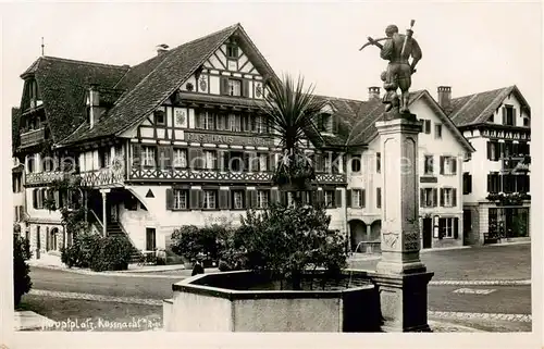 AK / Ansichtskarte Kuessnacht Hauptplatz mit Brunnen und Tell Statue Kuessnacht