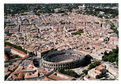 AK / Ansichtskarte Nimes_30 Vue generale aerienne Les Arenes 