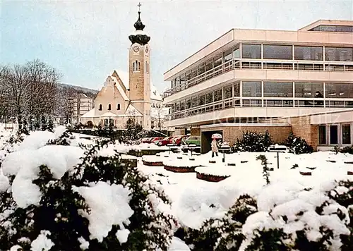 AK / Ansichtskarte 73842237 Bad_Brueckenau Kurmittelhaus und Marien Kirche im Winter Bad_Brueckenau