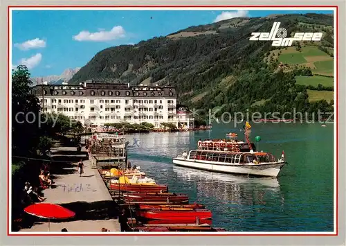 AK / Ansichtskarte 73848378 Zell_See_AT Uferpromenade mit Grand Hotel Fahrgastschiff 