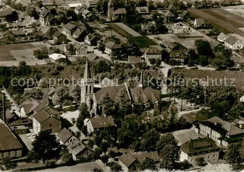AK / Ansichtskarte 73853462 Laggenbeck_Ibbenbueren Ansicht mit Kirche Original-Luftfoto 