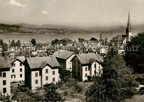 AK / Ansichtskarte  Waedenswil_Waedensweil_ZH Ortsansicht mit Kirche Blick auf den Zuerichsee 