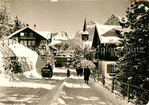 AK / Ansichtskarte Arosa_GR Dorfstrasse im Winterzauber Arosa_GR