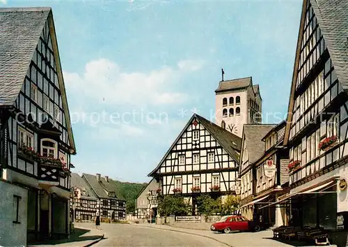 AK / Ansichtskarte 73865721 Fredeburg_Schmallenberg Kneipp-Kurort Ortszentrum Hauptstrasse Fachwerkhaeuser Kirche Fredeburg_Schmallenberg