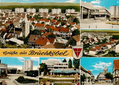 AK / Ansichtskarte  Bruchkoebel Stadtpanorama Rathaus Luftaufnahme Hauptstrasse Hallenbad Freibad  Buergerhaus Bruchkoebel