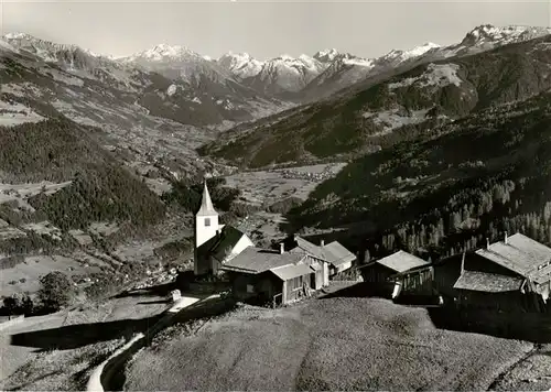 AK / Ansichtskarte  Furna_GR Bergdorf Kirche Panorama Blick gegen das obere Praettigau und die Silvrettagruppe 