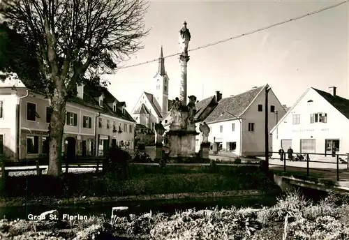 AK / Ansichtskarte 73872542 Gross_St_Florian_Steiermark_AT Ortspartie mit Brunnen und Kirche 