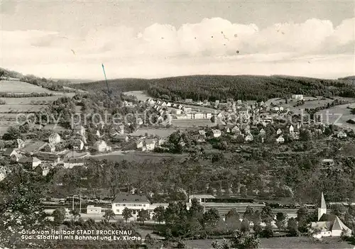 AK / Ansichtskarte 73873610 Bad_Brueckenau Suedl Stadtteil mit Bahnhof und Ev Kirche Bad_Brueckenau