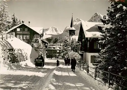 AK / Ansichtskarte  Arosa_GR Dorfstrasse im Winter Arosa_GR