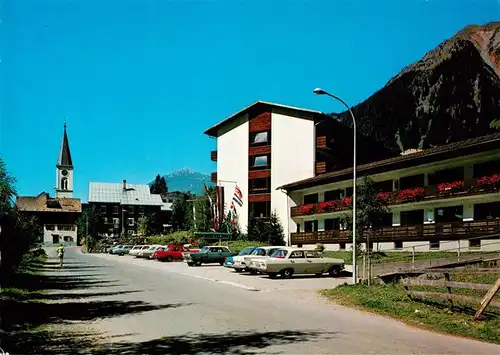 AK / Ansichtskarte 73875990 Gaschurn_Vorarlberg Ortspartie mit Kirche Gaschurn Vorarlberg