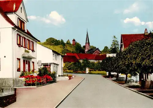 AK / Ansichtskarte  Ulrichstein Strassenpartie mit Kirche Ulrichstein