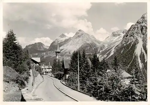 AK / Ansichtskarte  Arosa_GR Dorfkirche mit Furkapass Arosa_GR