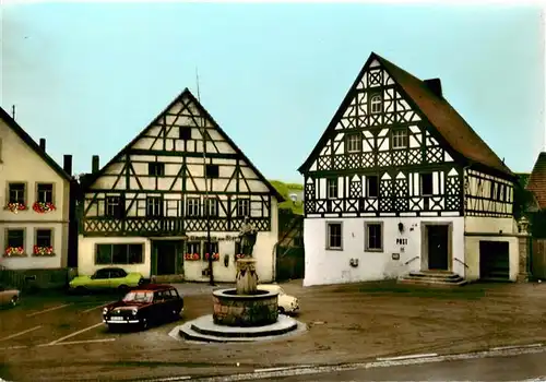 AK / Ansichtskarte 73887487 Geiselwind Fachwerkhaeuser Brunnen Gasthaus Geiselwind