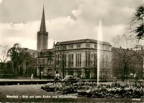 AK / Ansichtskarte 73887989 Bitterfeld Kath Kirche und HO Kaufhaus Bitterfeld