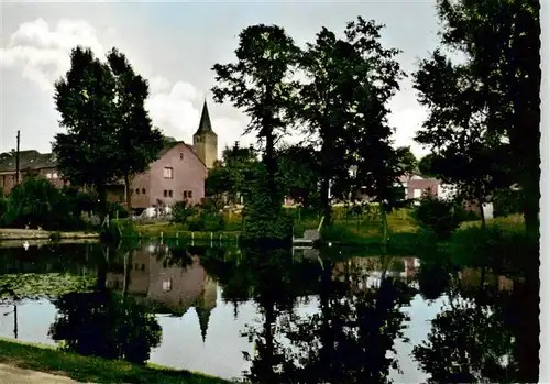 AK / Ansichtskarte 73895465 Niederkruechten Dorfweiher mit Kirche Niederkruechten