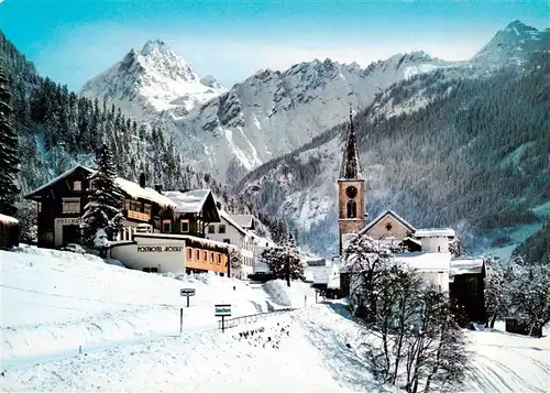 AK / Ansichtskarte  Gaschurn_Vorarlberg Ortsansicht mit Kirche Winter in den Alpen Gaschurn Vorarlberg