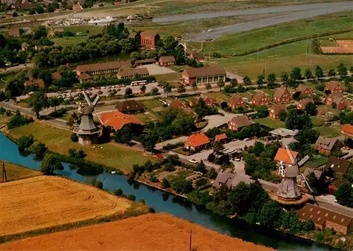 AK / Ansichtskarte  Greetsiel Fliegeraufnahme mit Zwillingsmuehlen