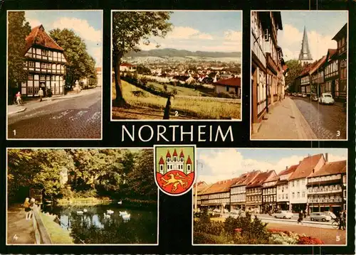 AK / Ansichtskarte  Northeim_Niedersachsen St Spiritus Panorama Hagenstrasse mit Kirche Schwanenteich Am Muenster