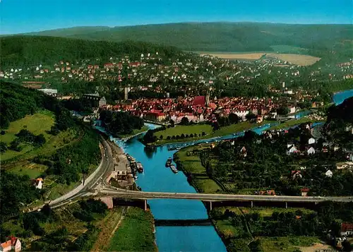 AK / Ansichtskarte 73945914 Hann._Muenden Weserbruecke mit Blick auf die Stadt