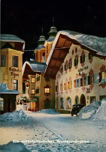 AK / Ansichtskarte  St_Johann_Tirol Ein Wintermaerchen Ortszentrum Gasthof Hotel Nachtaufnahme