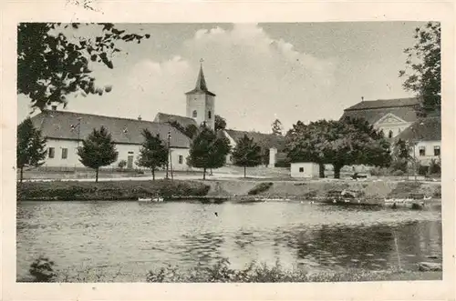 AK / Ansichtskarte 73959442 Mysliborice_Trebic_Trebitsch_CZ Partie am Teich Blick zur Kirche