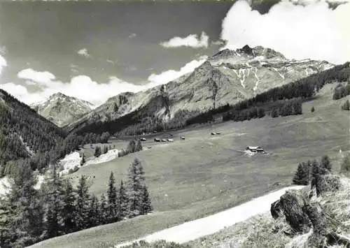 AK / Ansichtskarte  Samnaun_Dorf_GR Valmains e Pra S. Peder con Piz Tschuetta e Spi da Choeglias