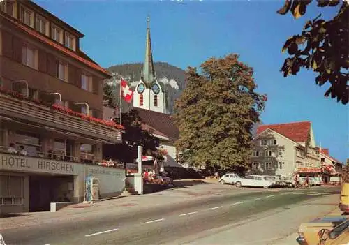 AK / Ansichtskarte  Wildhaus__SG Ortspartie mit Hotel Hirschen und Kirche