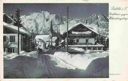 AK / Ansichtskarte  Seefeld_Tirol Tief verschneite Dorfstrasse Blick gegen Wettersteingebirge Serie Deutsche Heimatbilder