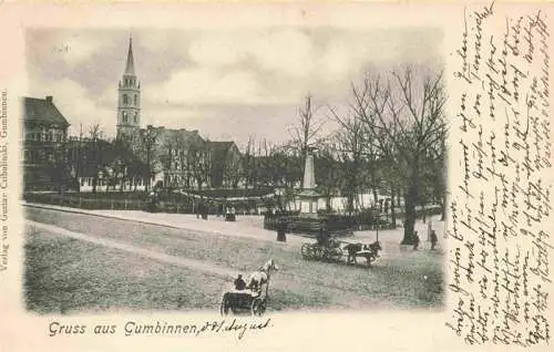 AK / Ansichtskarte  GUMBINNEN_Goesev_Gussew_Oblast_Kaliningrad_RU Partie am Denkmal Blick zur Kirche