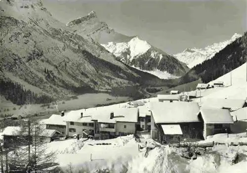 AK / Ansichtskarte  Medels_Rheinwald_GR Dorfansicht mit Blick zum Einshorn Winterpanorama Alpen
