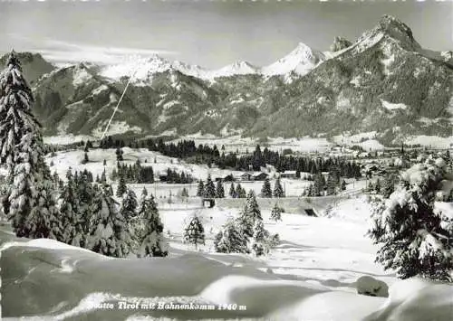 AK / Ansichtskarte 73982953 Reutte_Tirol_AT Winterpanorama mit Blick zum Hahnenkamm
