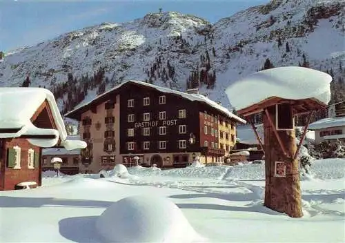 AK / Ansichtskarte 73985785 Lech_Vorarlberg_AT Gasthof Post mit Ruefikopf Wintersportplatz im Winterzauber