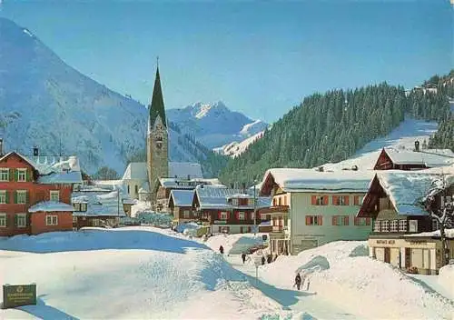 AK / Ansichtskarte 73986016 Mittelberg_Kleinwalsertal_AT Verschneites Dorf mit Kirche