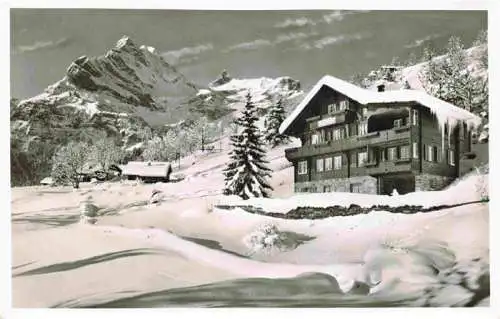 AK / Ansichtskarte  Braunwald_GL Pension Friedheim mit Ortsstock Winterpanorama Alpen