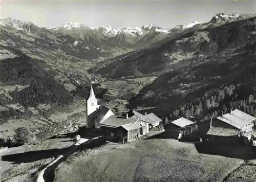 AK / Ansichtskarte  Furna_1361m_Praettigau-Davos_GR Fliegeraufnahme mit Kirche und Silvrettagruppe